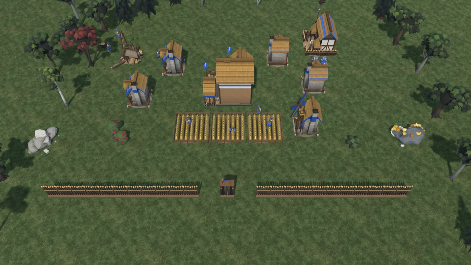 The Feudal Age town: more houses, a mill, barracks and a palisade with its gate