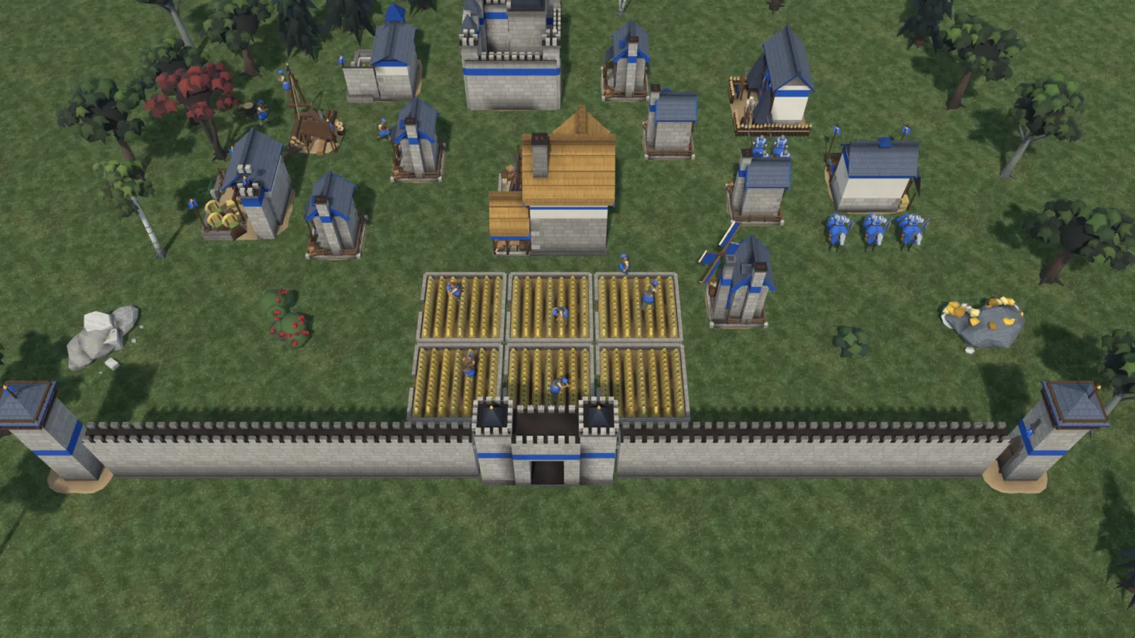 The Castle Age town behind stone walls and a gatehouse, with a keep and knights at the stable